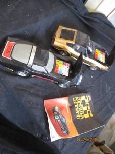 lot 57 image: Vintage 255 Computer Command Corvette and Datsun race cars