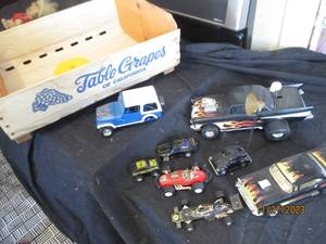 lot 59 image: Collection of assorted Vintage Race cars by Matchbox and other makers in wooden grape crate.