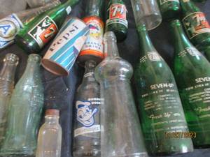 lot 65 image: Large variety of vintage Advertisement bottles and jars
