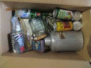 lot 94 image: Box of Vintage tins and glassware from 7up, Jack Daniels and more. plus Vintage National Lampoons Magazines