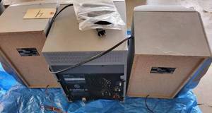 lot 4 image: Sharp C-D Player with Speakers and Two C-D Towers, C-D Stereo has a 3-Disc Rotary C-D Changer, and has an Antenna for AmFM Radio