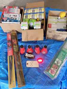 lot 8 image: Lot Containing Assorted Light Bulbs, 5-Bottles of Gas Treatment, Two New Wiper Blades, and a Small Working TrailerBicycle Red Light