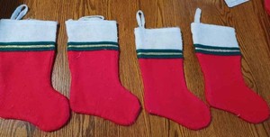 lot 65 image: Used 55-inch Giant Christmas Stocking and Four Small Matching Stockings