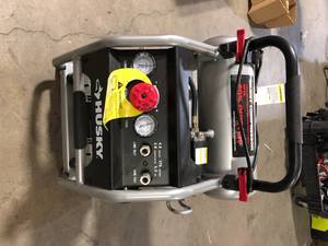 lot 4 image: Husky 4.5 Gal. Portable Electric-Powered Silent Air Compressor   Customer Returns See Pictures