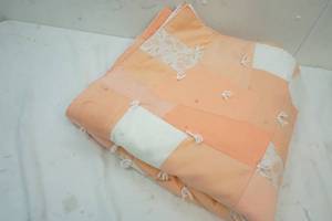 lot 244 image: Queen sized handmade peach and white quilt
