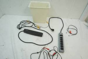 lot 295 image: 2 Power strips, audio cords, trash can