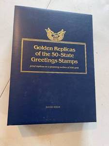 lot 55 image: 51 Golden Replicas of 50 State Greetings Stamps