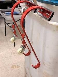 lot 18 image: Qual-Craft Ladder Hook with Wheels 2481