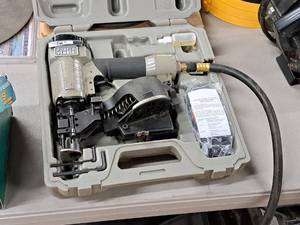 lot 217 image: Porter-Cable Air Roofing Coil Nailer with Case