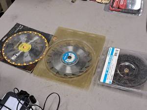 lot 395 image: 7-14 Saw Blades and 6 Wheel