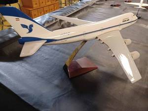 lot 20 image: Iran Air Die Cast Metal Airplane on a Wood and Metal Stand, Plane Measures 20-inches Long, 18-inches Wide - Wing tip to Wing Tip, and 11-inches from the