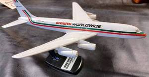 lot 26 image: Emery World Wide Plastic Airplane on a Plastic Stand, Plane Measures 11-inches Long, 10.25-inches Wide Wing Tip to Wing Tip, and 5.75-inches from the