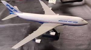 lot 32 image: Boeing 747-400 Plastic Airplane on a Plastic Stand, Plane Measures 14-inches Long, 13-inches Wide Wing Tip to Wing Tip, and 6.75-inches from the Bottom of