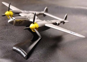 lot 38 image: Two Die Cast Metal Military Airplanes - Lockheed P38 Lightening Named Gentle Annie on a Plastic Stand, and an A10 Thunderbolt 2 - No Stand
