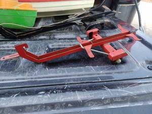 lot 57 image: Two Vintage Boat Trailers and Two Plastic Boats, Black Boat Trailers is Missing an Axle and Wheels, and a Plastic Chevrolet Pickup