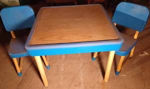 lot 66 image: Childs Plastic Table with Wood Grain Top and Two Chairs in Good Condition