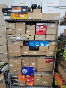 Rack of over 70 pairs of authentic name brand shoes - these shoes were bought from big box retail stores and outlets.  Some may have slight wear and blemishes. Low reserve of 900.00
