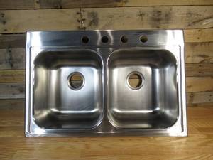 lot 138 image: Elkay Dayton Drop-In 33-in x 22-in Stainless Steel Double Equal Bowl 4-Hole Kitchen Sink (minor denting see pictures)