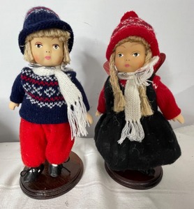 lot 82 image: 10 Porcelain Norwegian Dolls with stands and Skis