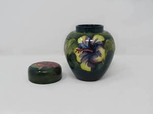 lot 18 image: A Moorecroft  green floral Hibiscus lidded pottery ginger jar