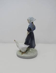 lot 22 image: Royal copenhagen porcelain figurine  girl with goose