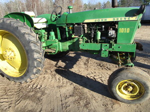 lot 1 image: JD 1010 Farm Tractor