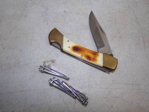 Large Knife and 3 Fingernail Clippers