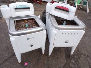 Pair of Wringer Washing machines used for planters dirt included