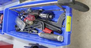 Bin of hex wrenches, saw, etc