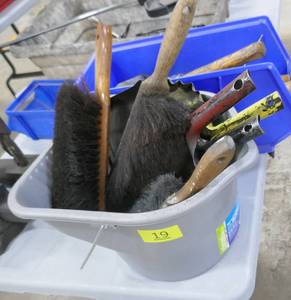 Bucket of dust pans and brushes