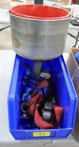 Bin of ratchet straps and 3 funnels