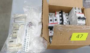 Box of 5 new ABB circuit breakers and bag of rails