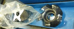 Bin with 2 new carbide insert cutting heads for mill