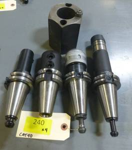 FOUR like new  CAT40 tool holders, collets