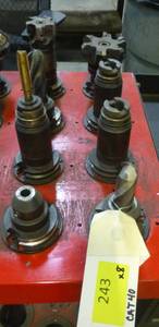Eight CAT40 tool holders, chuck collets, tooling