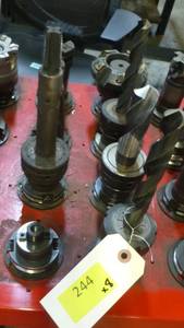 Eight CAT40 tool holders, chuck collets, tooling