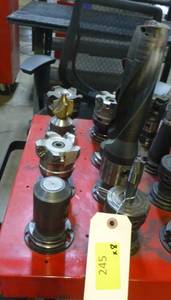Eight CAT40 tool holders, chuck collets, tooling