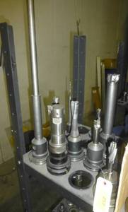 Twelve CAT50 tool holders, collets, tooling