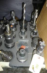Fourteen CAT40 tool holders, chuck collets, tooling