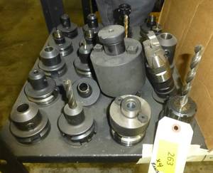 Twenty CAT40 tool holders, chuck collets, tooling