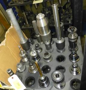 Twenty CAT40 tool holders, chuck collets, tooling