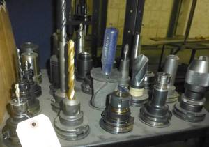 Twenty-Five CAT40 tool holders, chuck collets, tooling