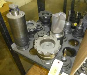 Twelve CAT50 tool holders, collets, tooling