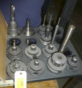 Eleven CAT50 tool holders, collets, tooling