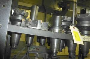 Eleven CAT50 tool holders, collets, tooling