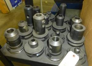 Sixteen CAT50 tool holders, chuck collets, tooling