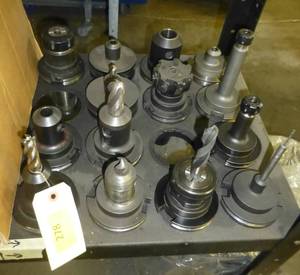 Fourteen CAT50 tool holders, chuck collets, tooling
