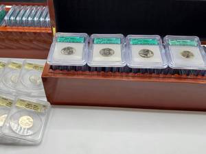 lot 3 image: Complete Set of 100 State &amp 12 Territorial Quarters in Graded MS67 Slabs &amp Wood Cases