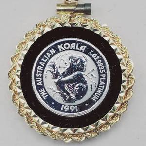 lot 10 image: 1991 120 Troy oz. Platinum Coin in 14K Bezel w COA