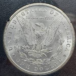 lot 18 image: 1884 CC Morgan Silver Dollar GSA Hoard, Original Packaging - Higher grade